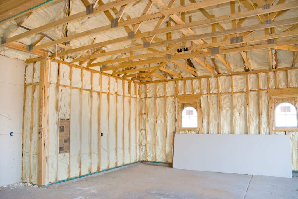 A room at a newly constructed home is sprayed with liquid insulating foam before the drywall is added.  Ideal for new home construction.