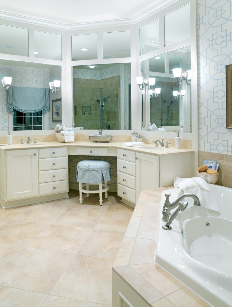 A custom mirror install in a large bathroom