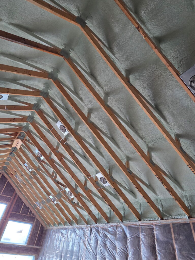 Spray foam insulation installed in cathedral ceiling rafters for a home in Crosslake, MN